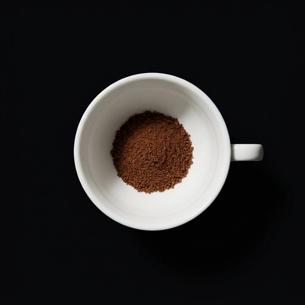 One scoop of powder in an empty cup